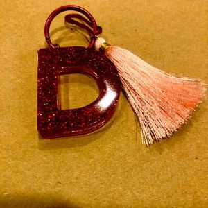 Keychain letters with tassels made of Resin.